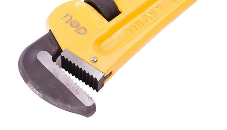 What type of wrench is best for gripping round objects?