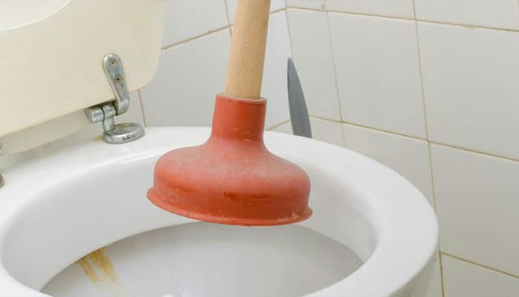 Which tool do plumbers use to clear clogs from drains?