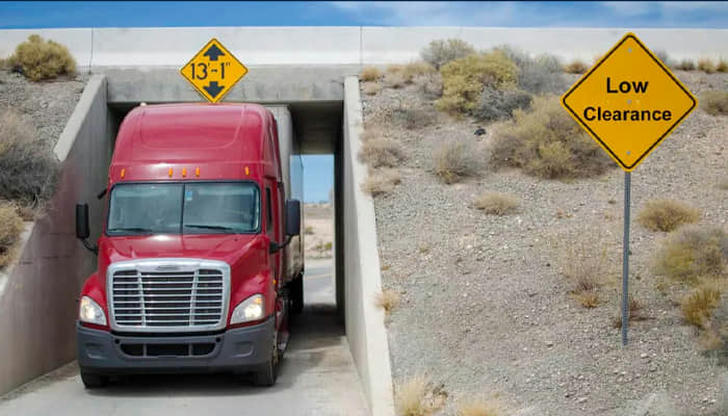 12. What does a "low clearance" road sign mean for big rigs?