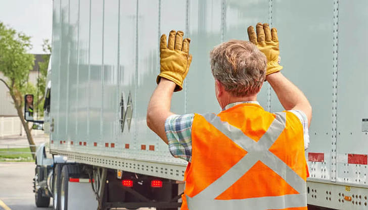 18. What is the recommended action when backing a big rig into a tight space?